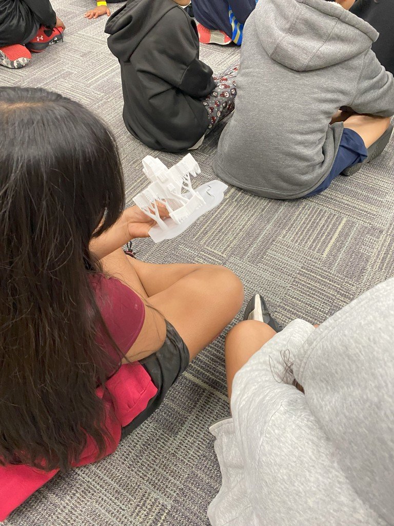 Brandon &amp; Angie Salfer visited summer school students to share their 3D Printer. They discussed how a 3D printer works, demonstrated “printing” a boat, and answered many questions. Students found the process fascinating!