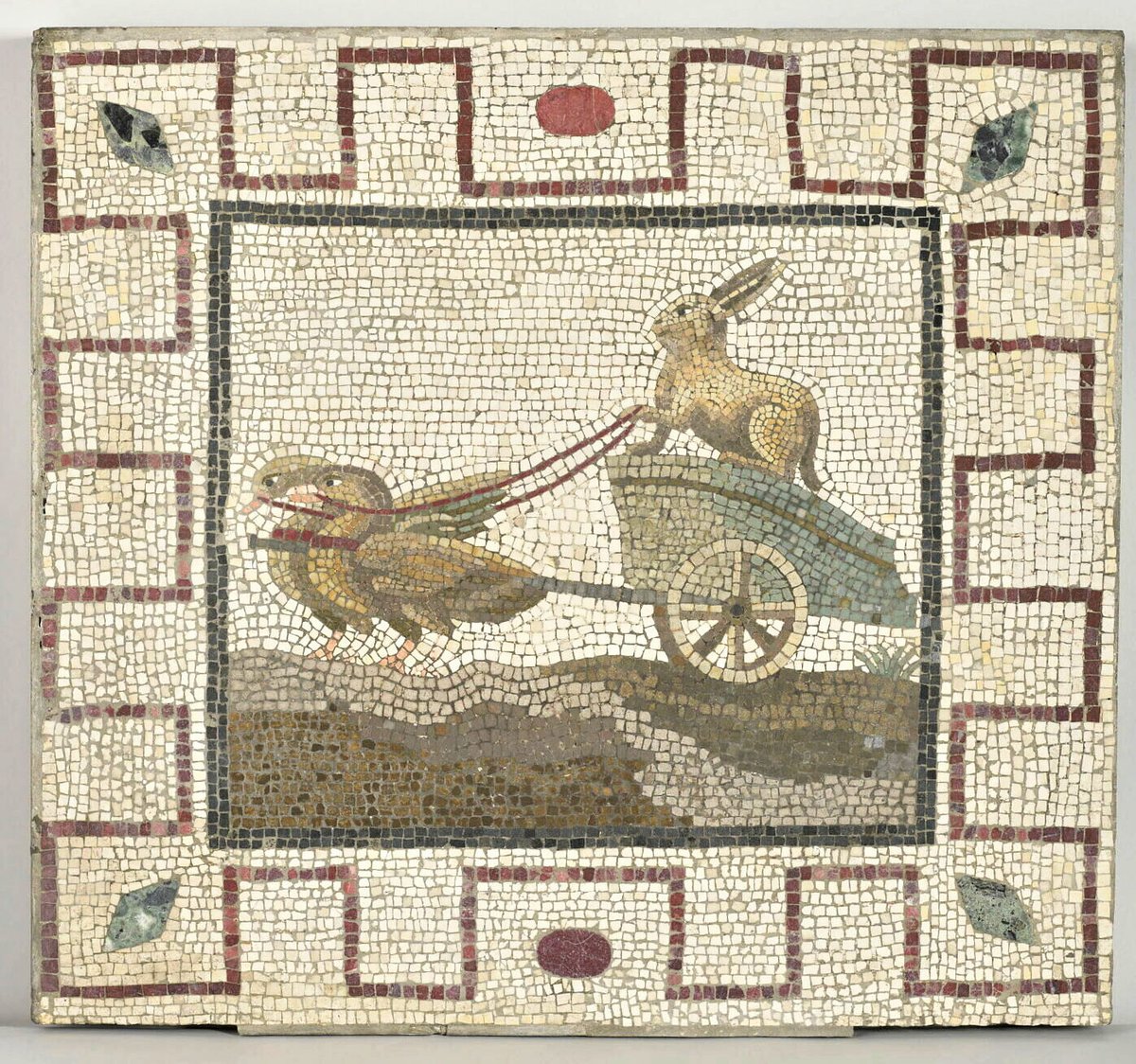 Ancient Roman mosaic depicting a rabbit driving a chariot pulled by geese. Date: Roman Period. Currently housed in the Department of Greek, Etruscan, and Roman Antiquities at the Louvre Museum, Paris.
