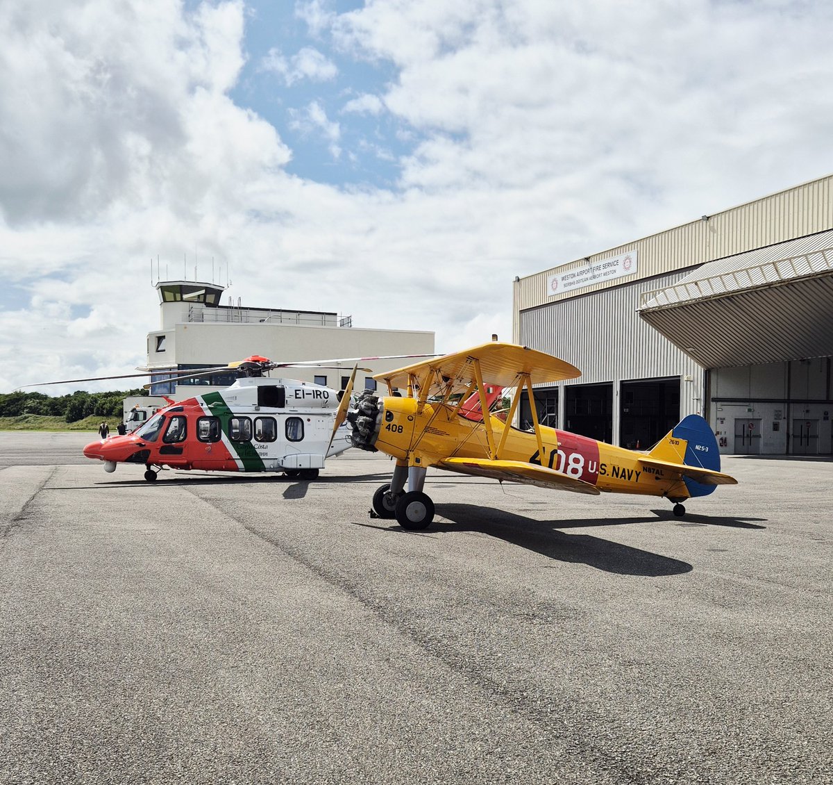 westonairport's tweet image. The majestic Boeing Stearman on the apron at Weston today. A great mix of old and new alongside the @Bristow_Group AW189, both adding some great colour on a summer's day! 🌞😎