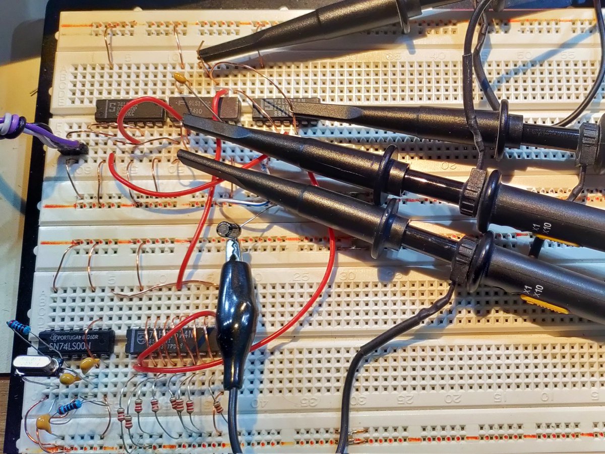 matseng's tweet image. The oscilloscope sure is colorful and pretty when all four channels are in use ;-) I'm currently debugging a part of my old long term project to make a USB device out of only 74LS series logic. The digital sim is working fine so now I've started the actual build. #summerProject