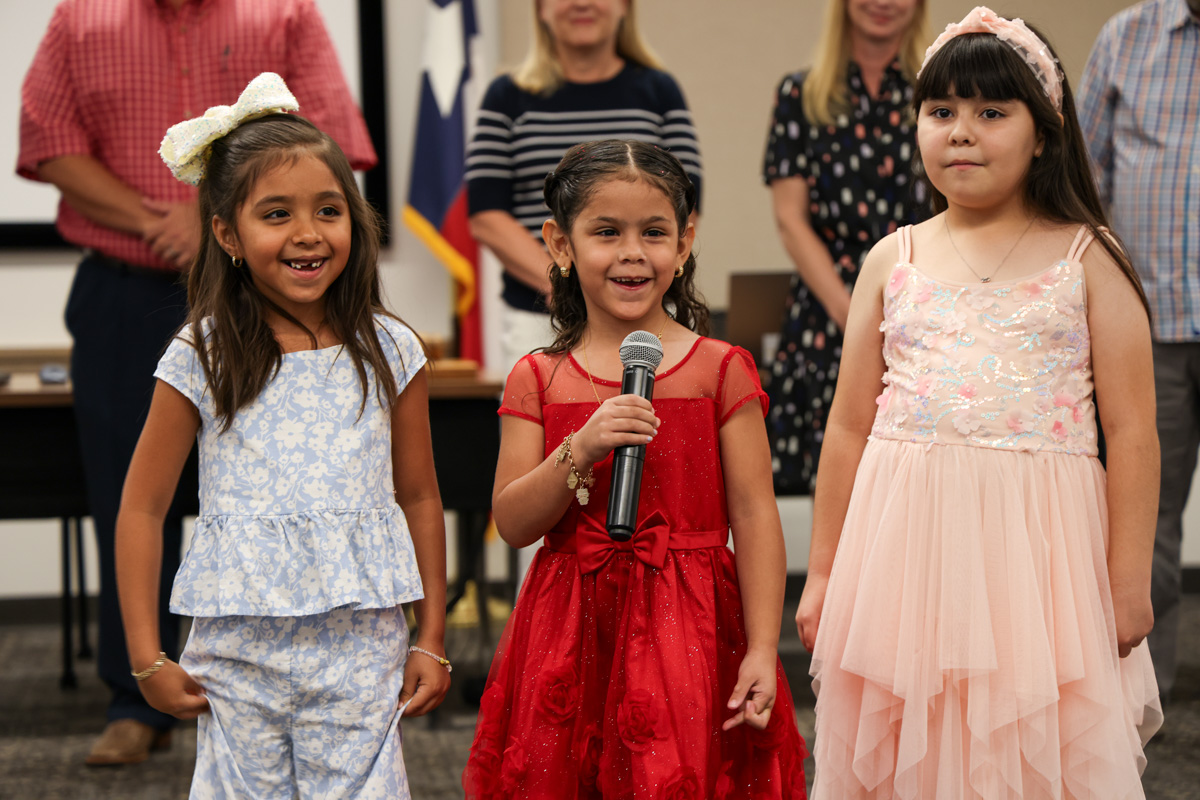 CSISD's tweet photo. Leading the pledges is an important job at #CSISDBoard meetings – our Bilingual Summer School students dressed the part and brought BIG smiles! This program helps young learners build language skills and confidence for the school year ahead. #CSISDTogether https://t.co/Lk89kdF7tz