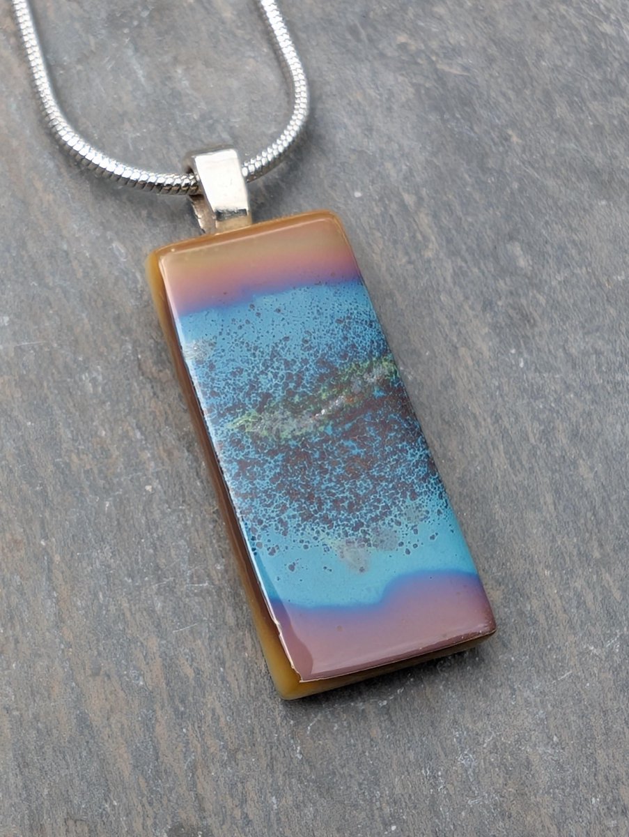 A new unique murmuration of birds flying over a cove inspired fused glass necklace. Beautiful handcrafted fused glass pendant and gift ideas. 

#handmade #etsy #giftideas #shopindie #nature

samphireglass.etsy.com/listing/432095…
