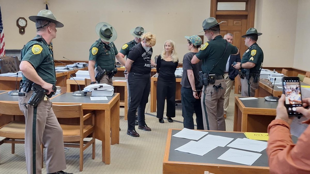 ColinGBooth's tweet photo. NEW: Multiple disability rights advocates arrested in the New Hampshire State House this afternoon after staging a “die in” to protest cuts to Medicaid in the state budget. #NHPolitics https://t.co/JwrWiGIjnt
