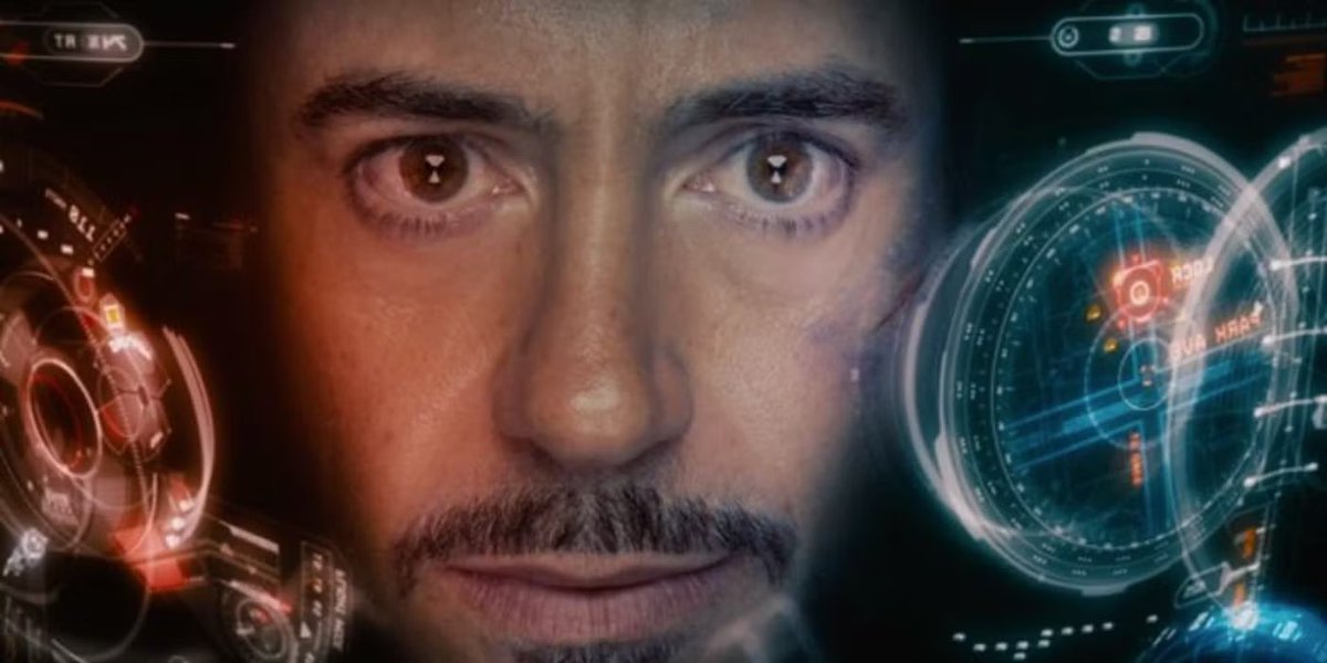 Tony Stark in his Anti-Joker Armor watching as Joker pulls out a bottle of Jack Daniels