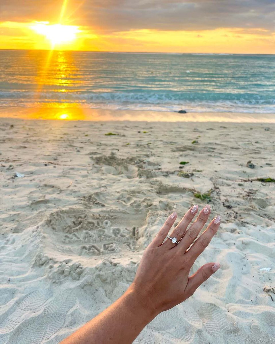 It was romance at golden hour for Megan  &amp; Liam as their dreamy beach engagement shows that paradise is just a love story away. Her Thyme engagement ring sparkled in the sunlight, as she said yes to forever 💍☀️

 #beachengagement #lovestory #paradiseproposal