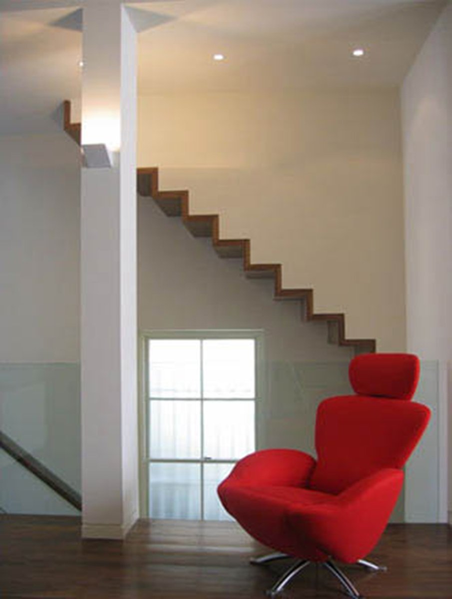 Cannon Place remodelling; a timber-clad folded steel sheet creates the lightest of cantilevered stairs  for the core circulation