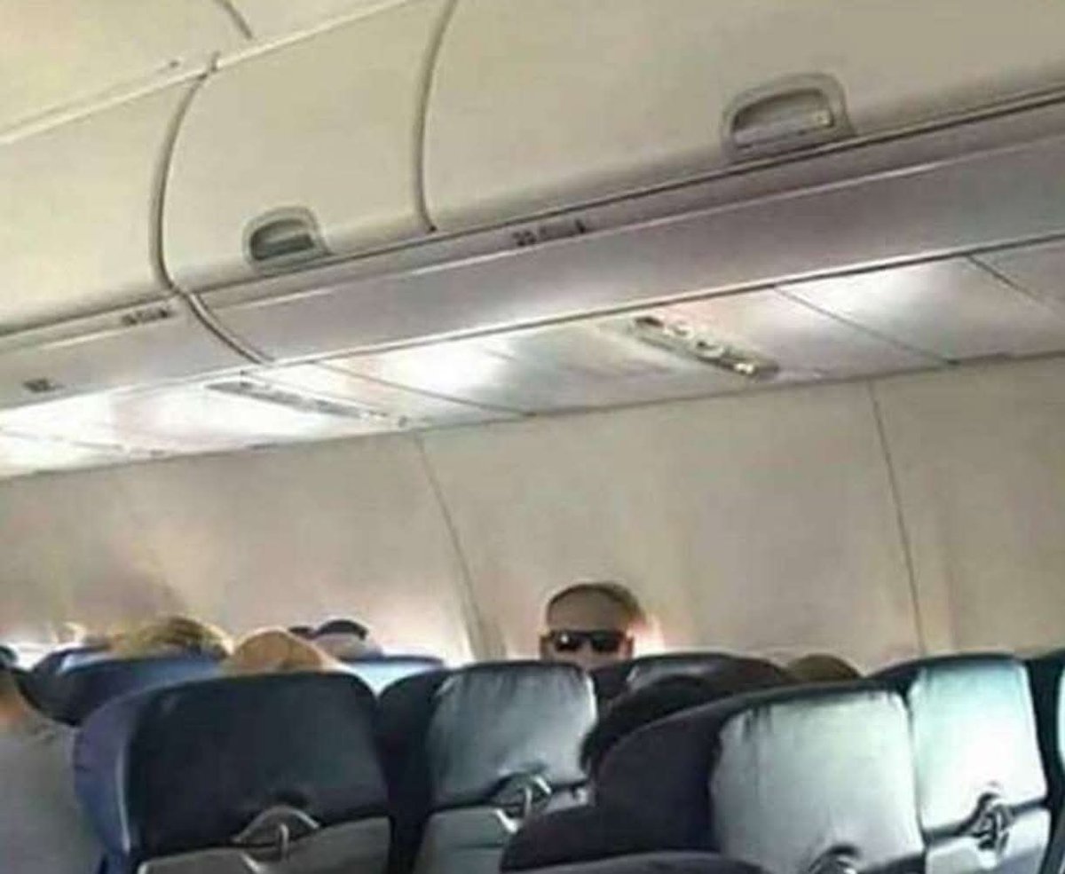 Imagine this guy staring at you throughout the flight. Only when he stands up, you realize he had just put his sunglasses on the back of his head.