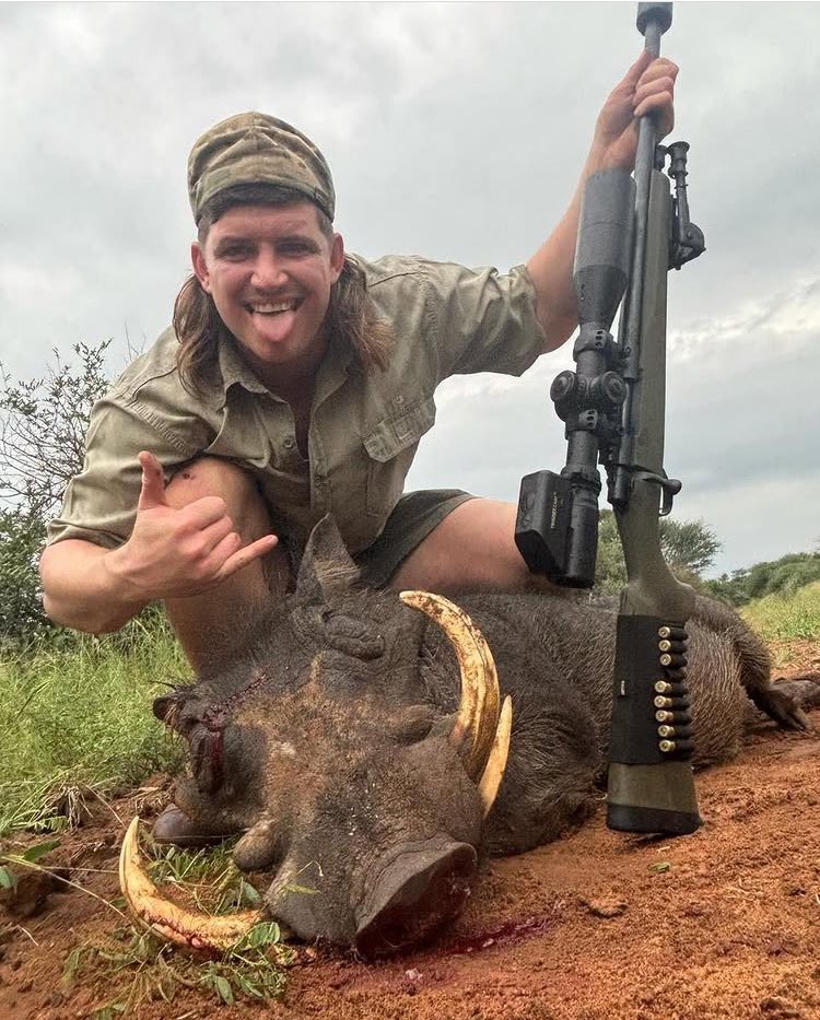 Benhard Johannes Janse van Rensburg is a South African professional rugby union player with a sordid pastime!

Here he is posing absurdly with a Warthog that he has slaughtered! 😡