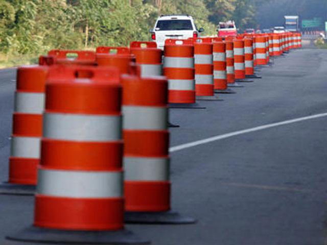 Orange barrels are the dandelions of a highway (swear to God)…..