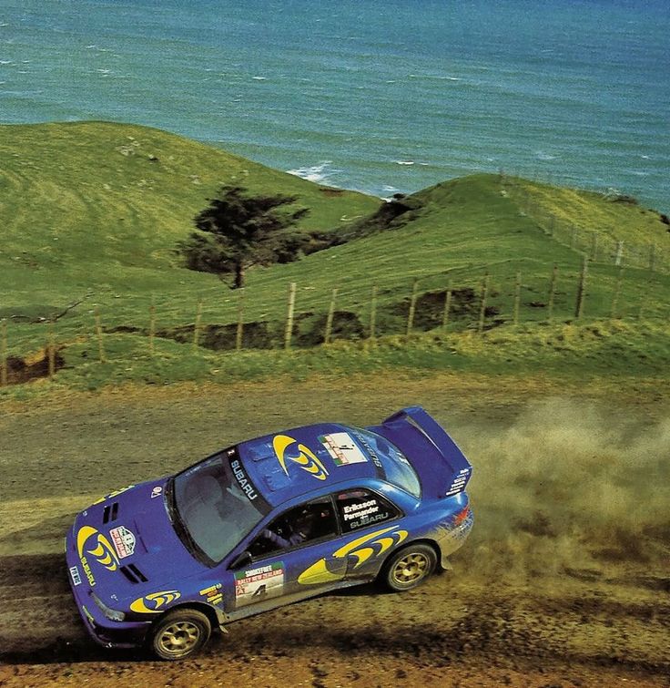 🔳  Rally New Zealand 1997. Kenneth Eriksson and Staffan Parmander, at the helm of the Subaru Impreza S5 WRC '97, carving out their victory on the flowing gravel roads and coastal vistas of the North Island.

Captured here in full flight - 555 livery, tail out, commitment