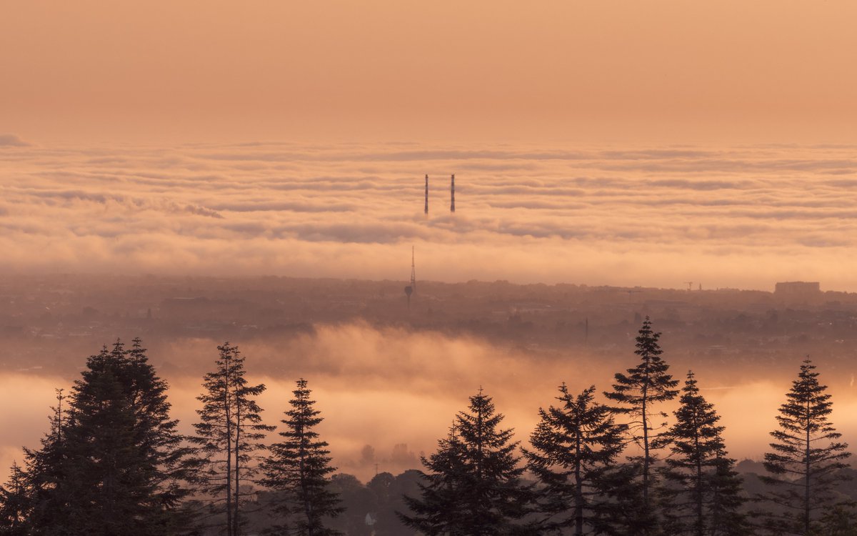sryanbruenphoto's tweet photo. The Poolbeg Chimneys standing out of the fog this morning in Dublin, captured from Kilakee Viewpoint. https://t.co/JcWDrqiXPO