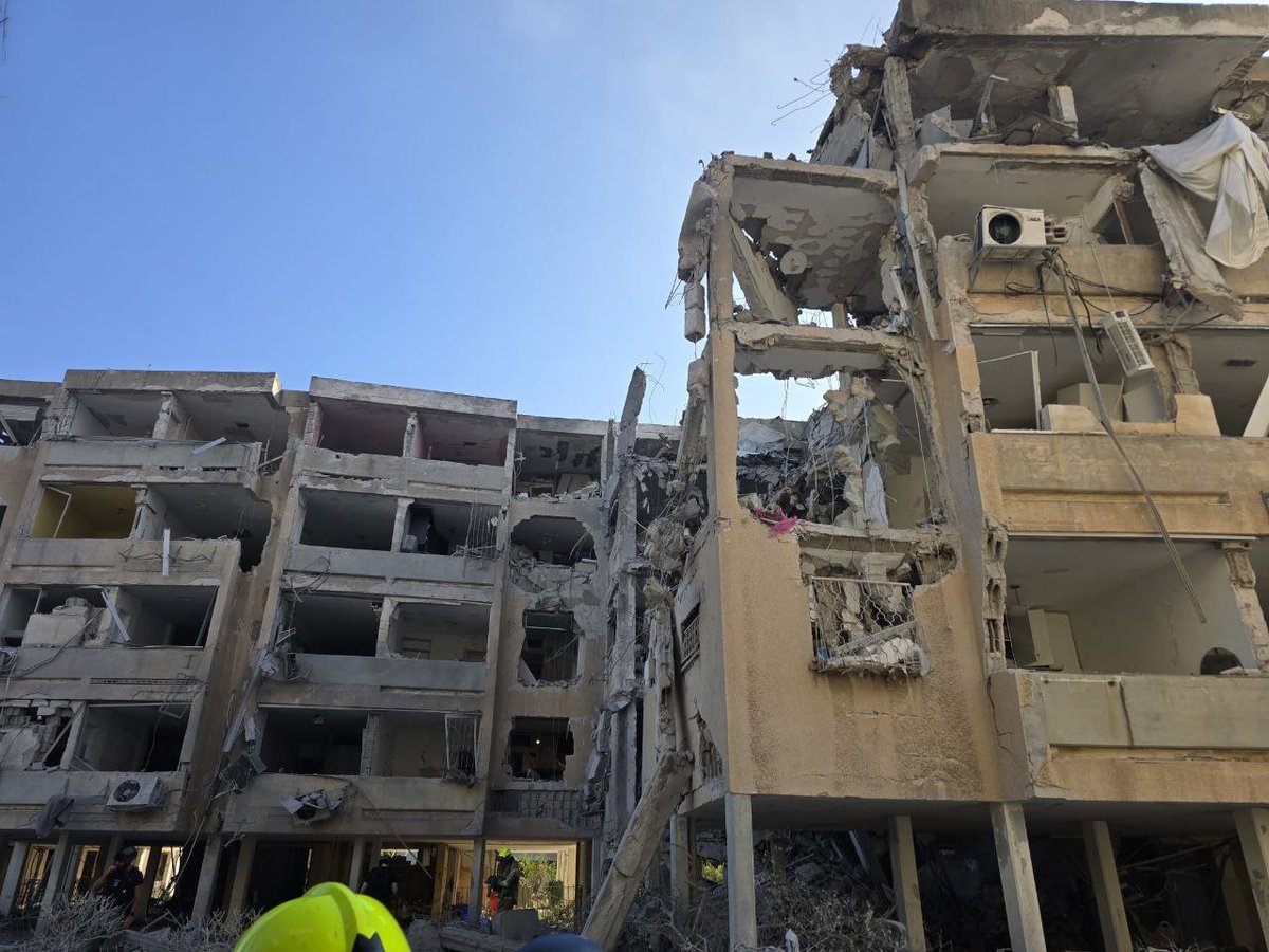 A building in what appears to be central Israel has suffered significant damage following a reported strike.
Rescue efforts are underway.
No official confirmation yet on casualties.
#IranIsraelConflict 
#IsraelIranConflict 
#TelAviv