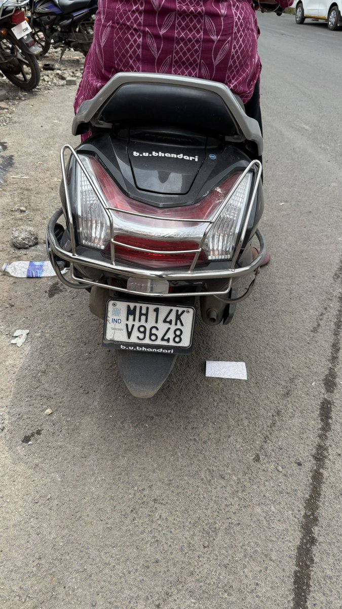 khalidbagwan's tweet photo. A woman collided with my car and fled the scene without discussing any details. When I requested her insurance information for a third-party claim, I discovered that she did not have a valid insurance policy. 
Her bike no: MH14KV9648
What action should be taken?
 @PuneCityTraffic https://t.co/9Ri3bjMKHS