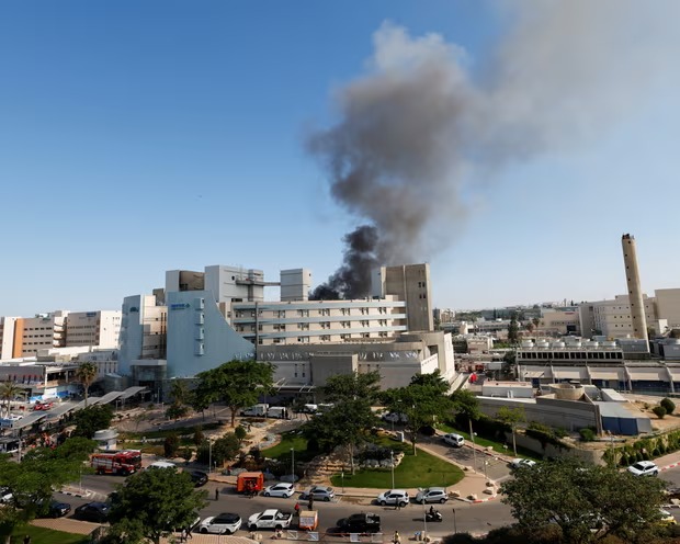 Iranian missile hits hospital in southern Israel, Tensions continue to rise in the region.
Smoke rises from Soroka Medical Center following a missile strike from Iran on Israel, in Beersheba on Thursday.

#IsraelIran #BreakingNews #MiddleEast #Iran #iranisraelwar