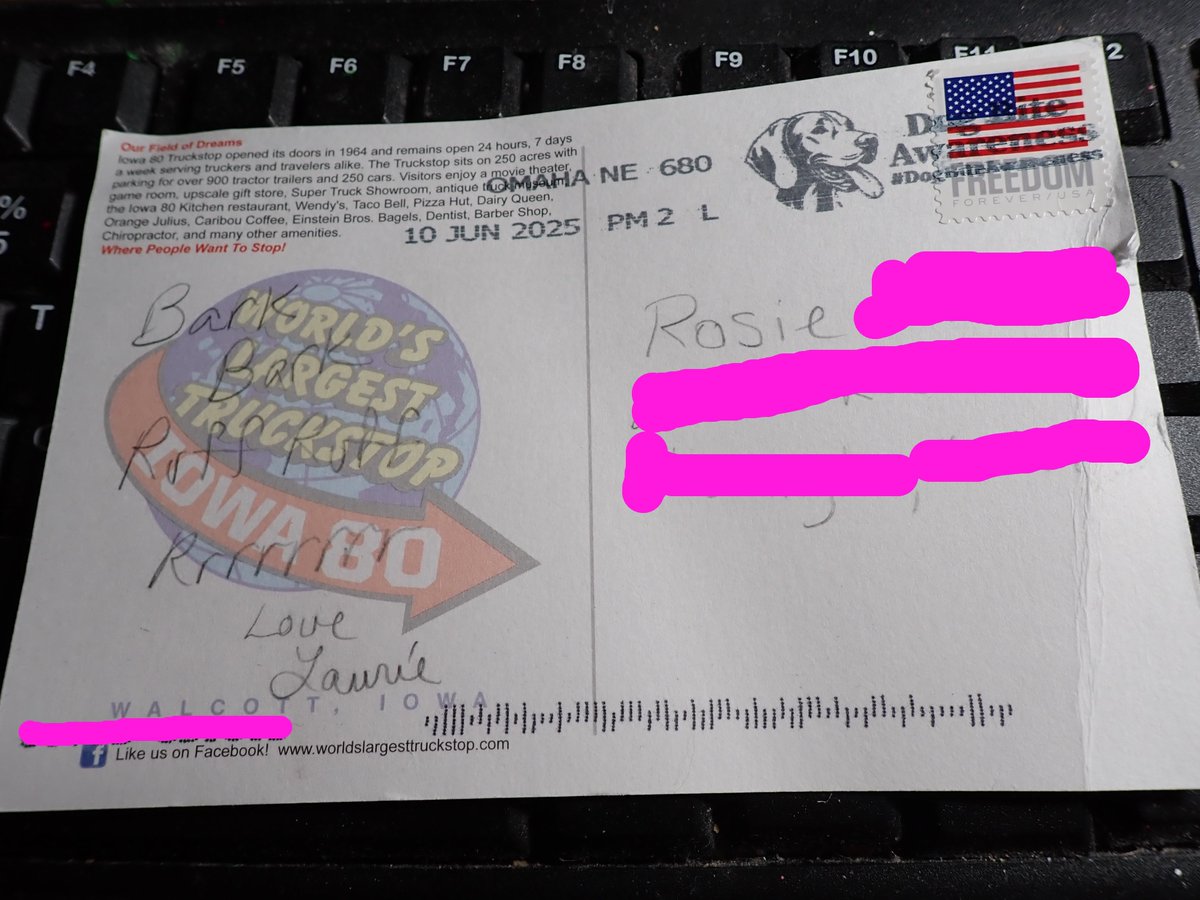 Rosie got a postcard from Nebraska!  Geez, that took a while.  The post office was nice enough to put a doggy picture next to the stamp.
