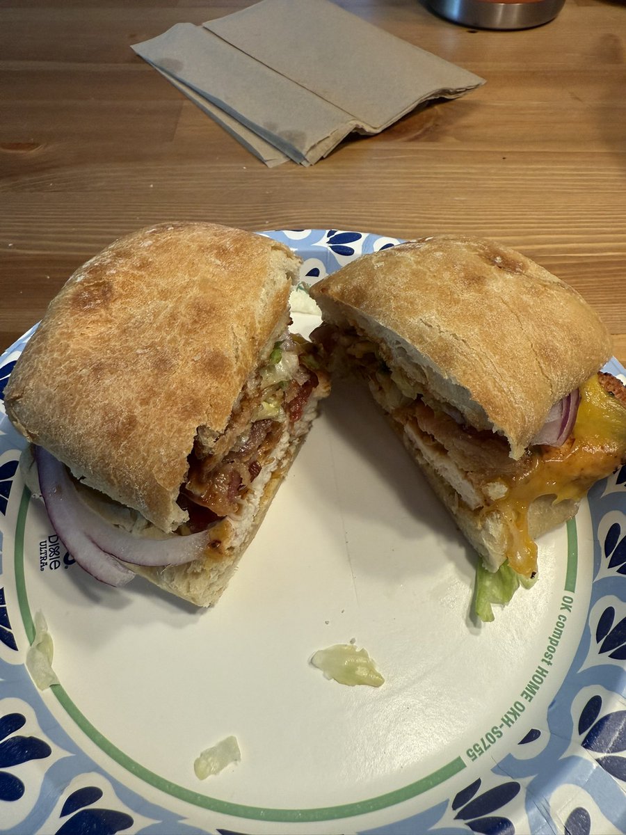 Tonight’s dinner.  BBQ chicken sandwich with cheddar, bacon, onions, and lettuce on ciabatta.