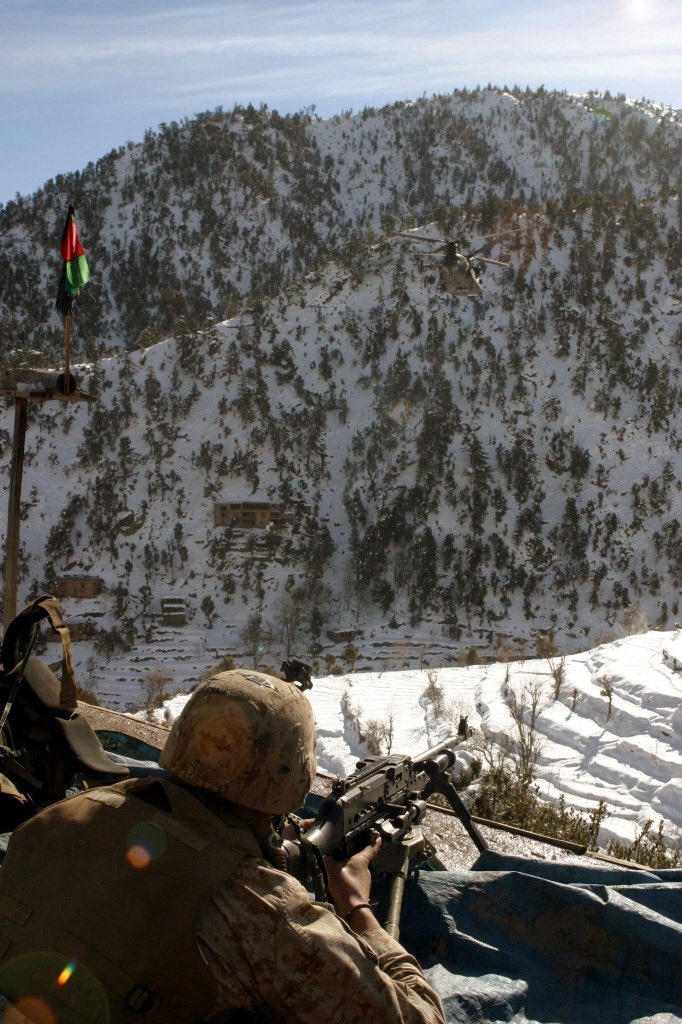 3/3 Lima Co Machine Gunner, Josh Ploetz, looks over the sights of his M240G machine gun as another CH47 Chinook helicopter prepares to drop medical supplies near the Marines’ position high in the Hindu Kuch mountains during Operation Spurs, Jan/Feb 2005.
-
Painted tripod spotted.