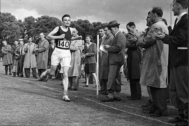 Alan Turing was a world class runner:

"While working at Bletchley, Turing, a talented long-distance runner, occasionally ran the 40 miles (64 km) to London when he was needed for high-level meetings, and he was capable of world-class marathon standards. Turing tried out for the