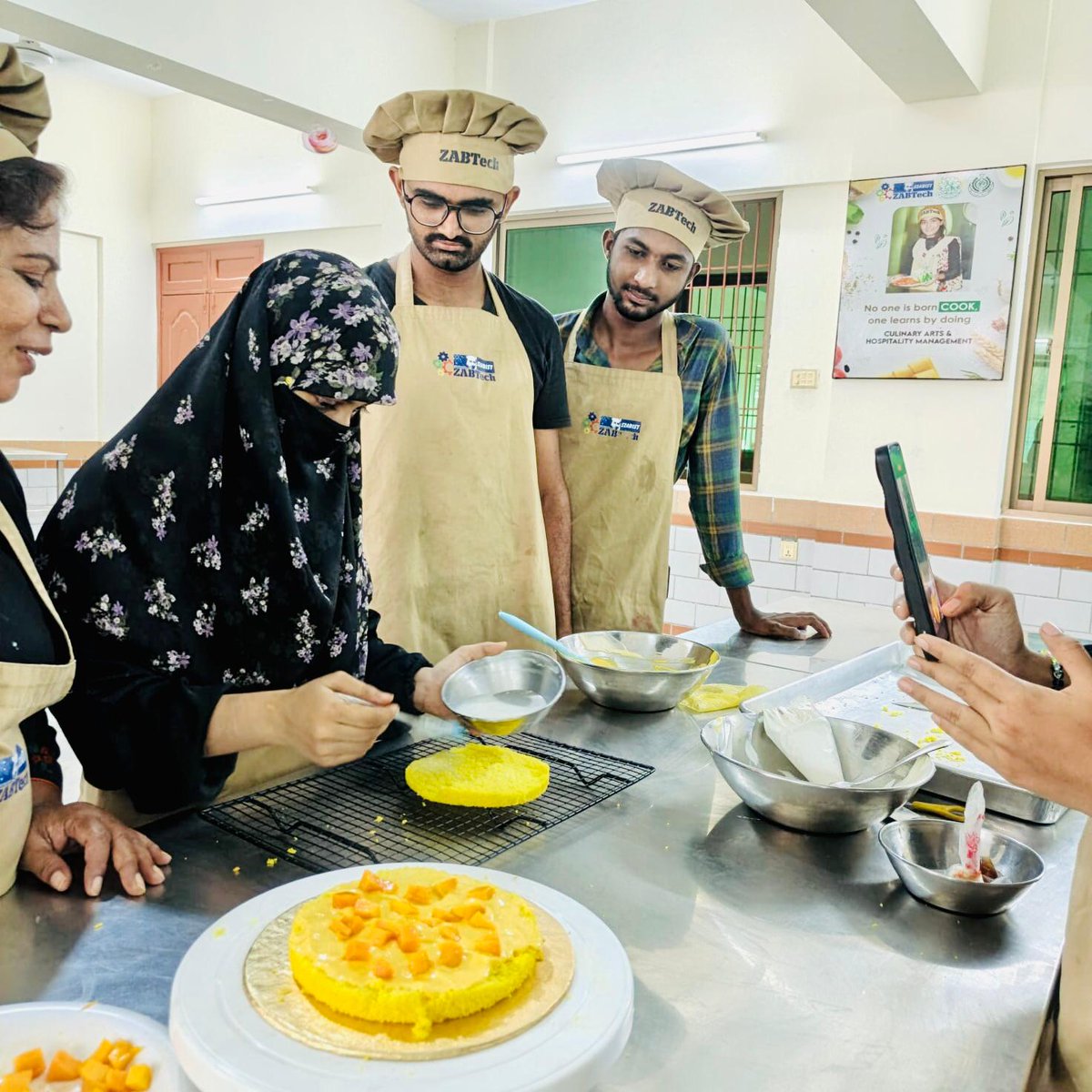 SzabistZabtech's tweet photo. Students at SZABIST ZABTech Karachi (Azam Town) showcased their culinary expertise by preparing a delicious Mango Cake, demonstrating both technical skill and creative flair.

#ZABTechKarachi #VocationalExcellence #CulinaryTraining #SkillDevelopment #MangoCake #TVETPakistan #BakingWithPrecision #StudentShowcase #AzamTownCampus #HunarmandNojawan