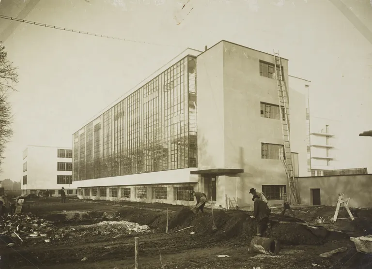 zarandillo's tweet photo. Bauhaus building Dessau, architect Walter Gropius, southwest view, construction site photo, 1926. https://t.co/c1nfD5cMRb