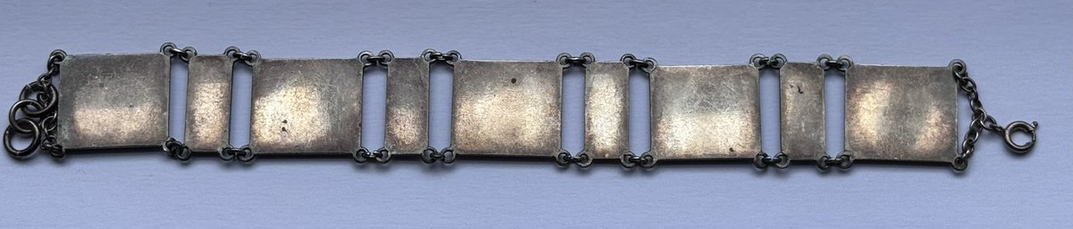 New on display- ‘A metal bracelet made by a German prisoner of war and given to Mrs Cheeseman as a thank you for the time spent working at the nursery’. From the Chessemen Collection.
