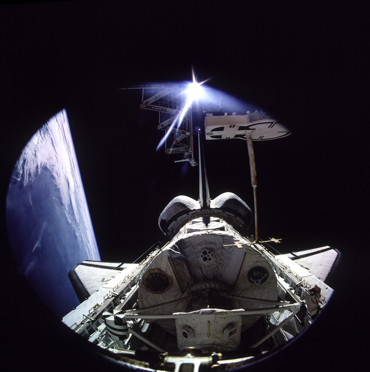 30 years ago this week, a space shuttle docked with the Mir space station for the first time.

In this photo taken from Mir, we see Atlantis's aft cargo bay with the Spacelab science module. Inside, STS-71 and Mir-18 crews were busy performing life science research.