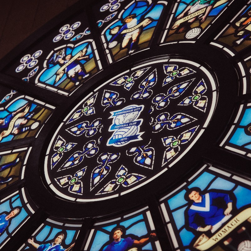 BCFC's tweet photo. Following the launch of our 150th anniversary home kit, supporters will have noticed the stained-glass window in the background of many of the images shared. 🖌️

Now, we tell you the story behind it.