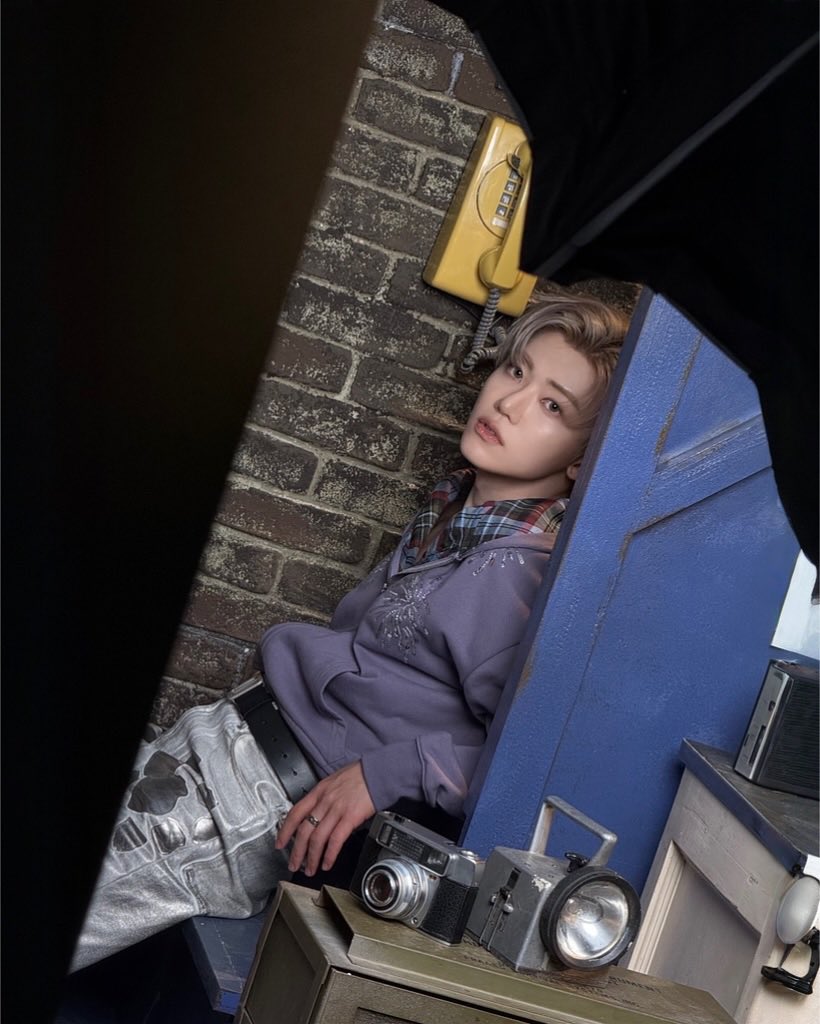 Waiting on a call that never came — so I talked to the quiet instead. Yellow phones, gray thoughts.