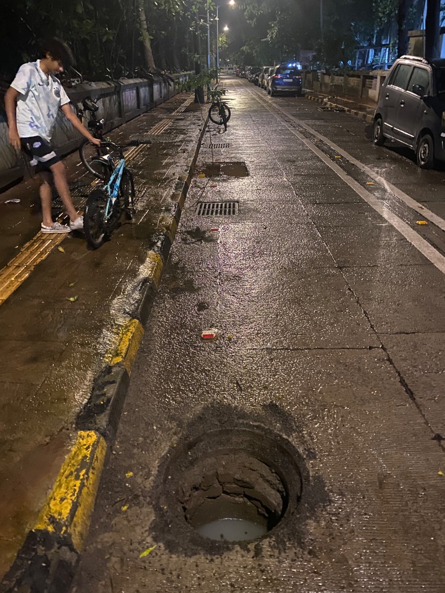 nirmiththakur's tweet photo. My younger son narrowly escaped falling into an open manhole opposite Santa Nagar bus depot. His cycle’s front wheel went fully in, saving him from falling. God saved him, but BMC’s negligence could’ve cost his life. Action must be taken! @mieknathshinde @miprakashsurve  @mybmc https://t.co/ftKo7MllSZ