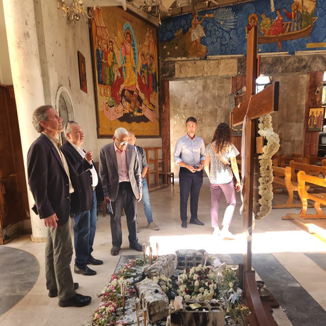 CRS President and CEO Sean Callahan joins colleagues from the CRS and <a href="/caritassyria/">Caritas Syria</a> teams in #Damascus to pay respects at the Mar Elias Church, which was severely damaged in a bombing in June that claimed 25 lives.