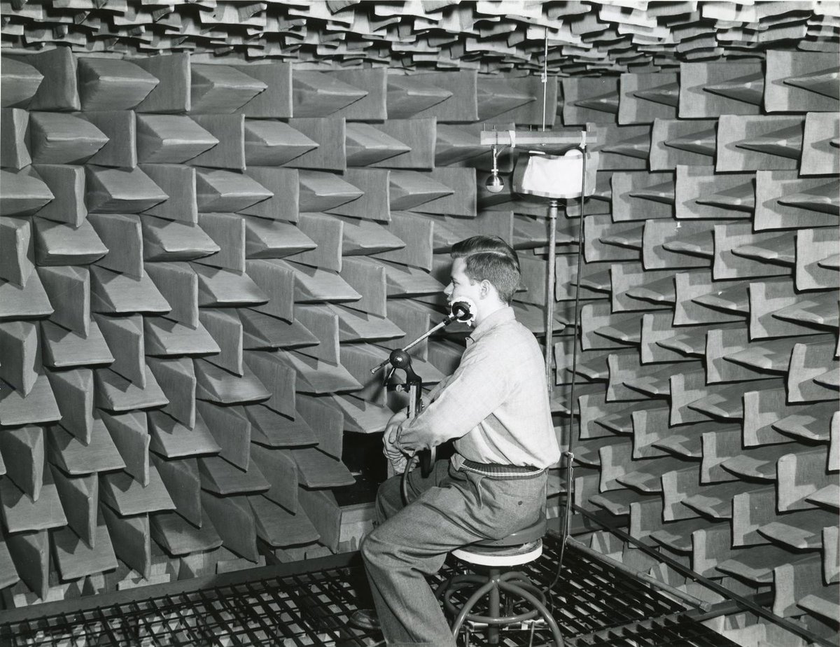 IITEngineering's tweet image. In this undated photo from the Parmly Sound Laboratory (circa 1946–1960), Illinois Tech student Jack Kiser participates in a binaural hearing experiment—listening to two tones in a completely silent anechoic chamber to determine their direction.