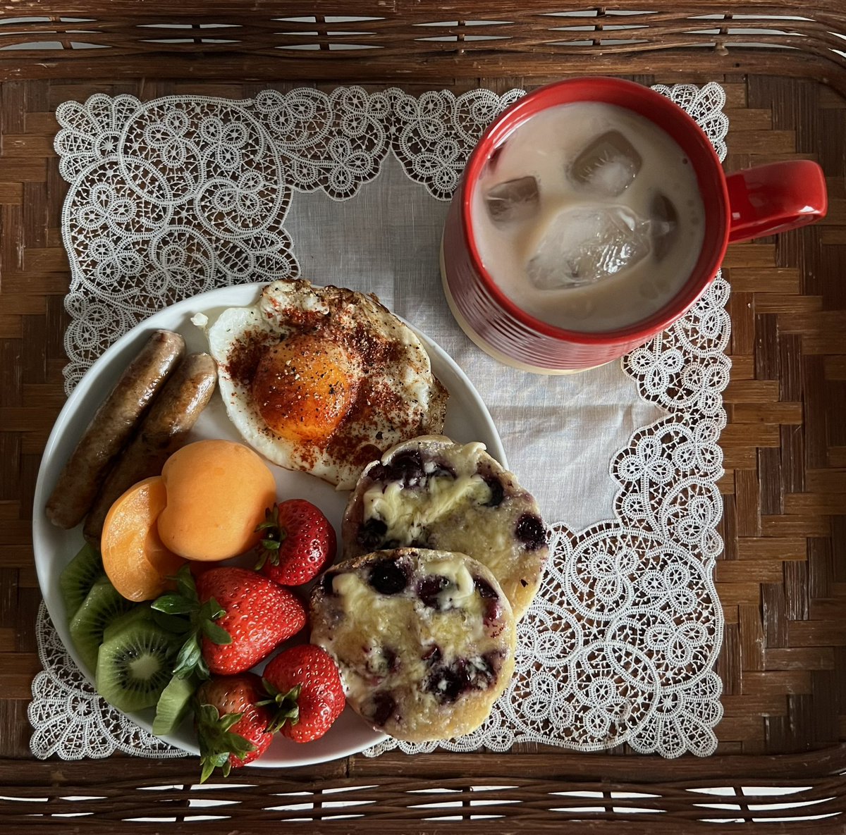 kaylaxbrianne's tweet photo. homemade blueberry english muffin with honey butter, fruit, sausage, egg, and iced chai. 

the best breakfast a girl can have (it’s 1 PM) https://t.co/i5YAyW8eqs