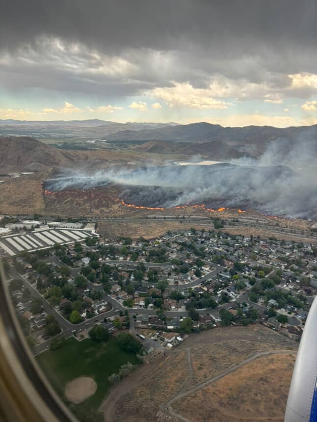 OurTownReno's tweet photo. Photos of the #barronfire from above from a Southwest plane yesterday afternoon in the Huffaker Hills area in southeast Reno which was quickly stopped in its forward progress thanks to rain and an all out regional firefighting effort which included plane drops of retardant. https://t.co/tjV2ulcgTT