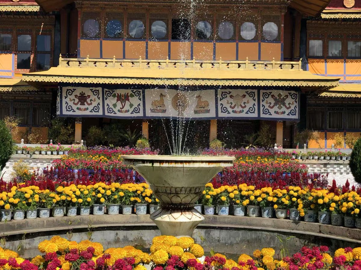 Who decides the reincarnation of a senior Tibetan lama-the Buddha, the monasteries, or the state?

In recent years, and even in recent days, the 14th Dalai Lama has made a series of striking public statements about his next life, including the possibility of being reborn as a