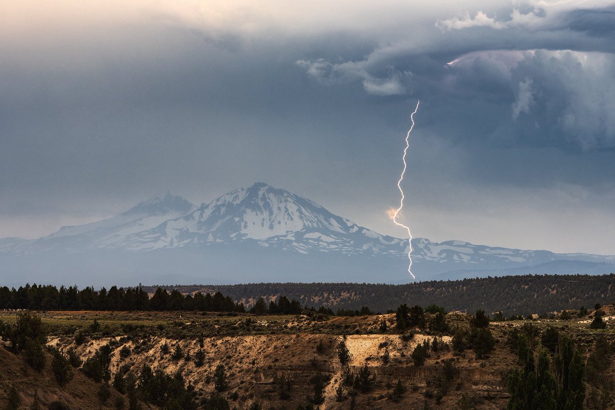 Lightning strike in front of the North Sister yesterday afternoon in Central Oregon. While not the most photogenic storm it was still awesome to get out and finally see some thunderstorms roaming the high dessert. #orwx