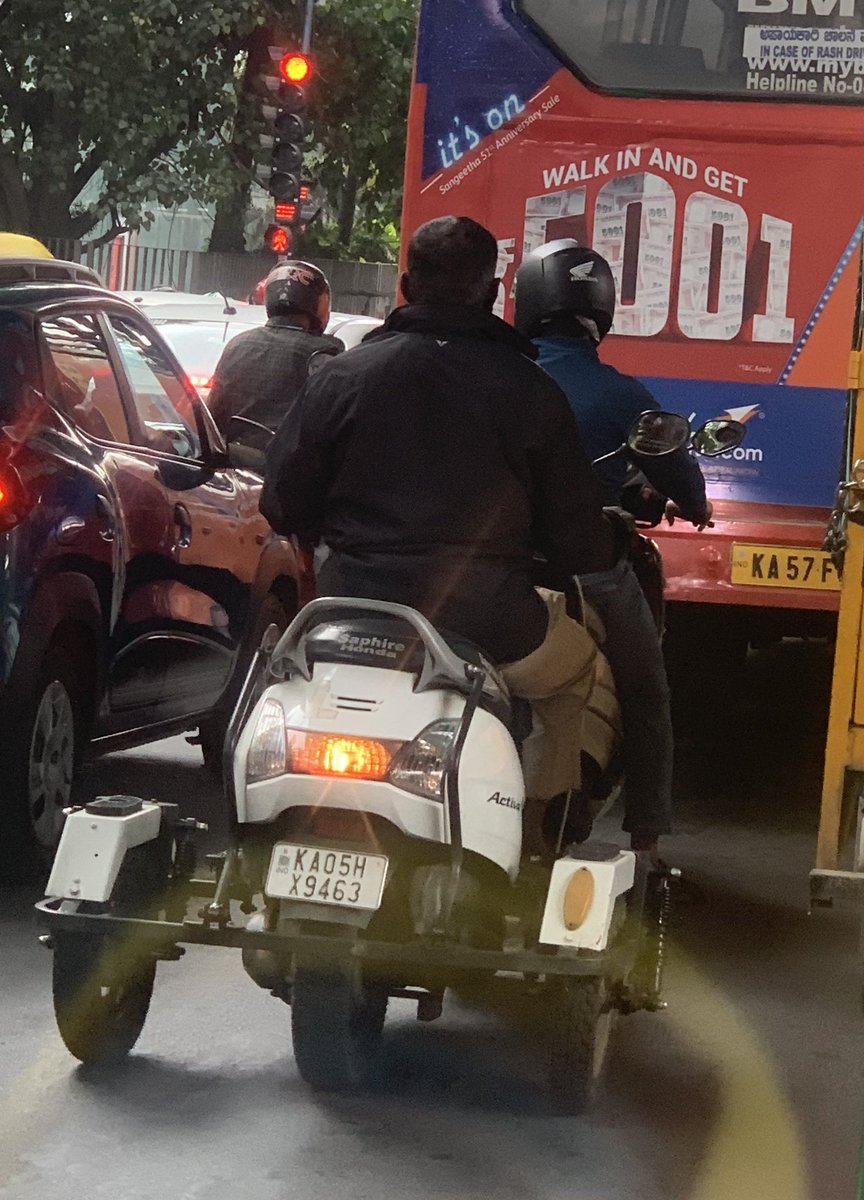 Dear <a href="/madivalatrfps/">MADIVALA TRAFFIC BTP</a> <a href="/blrcitytraffic/">ಬೆಂಗಳೂರು ಸಂಚಾರ ಪೊಲೀಸ್ BengaluruTrafficPolice</a> 
When you say four wheelers need not wear helmets, do you include these people too?
They are disabled; they have to be more careful
Pls take action
Madivala lake signal at Ring Road