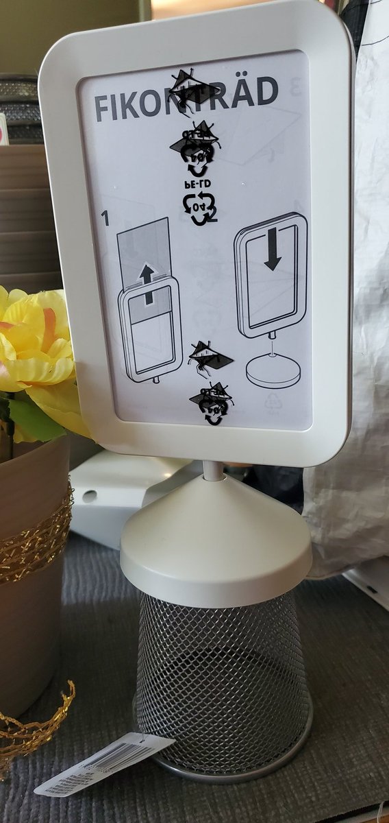I've decided on a garden theme for my new elementary school library. I wanted to incorporate these new frames I bought from <a href="/IKEAUSA/">IKEA USA</a> into the theme. So I bought some plastic flower pots, glued some flowers, turned a pencil cup upside down and glued it, and then glued the frame.
