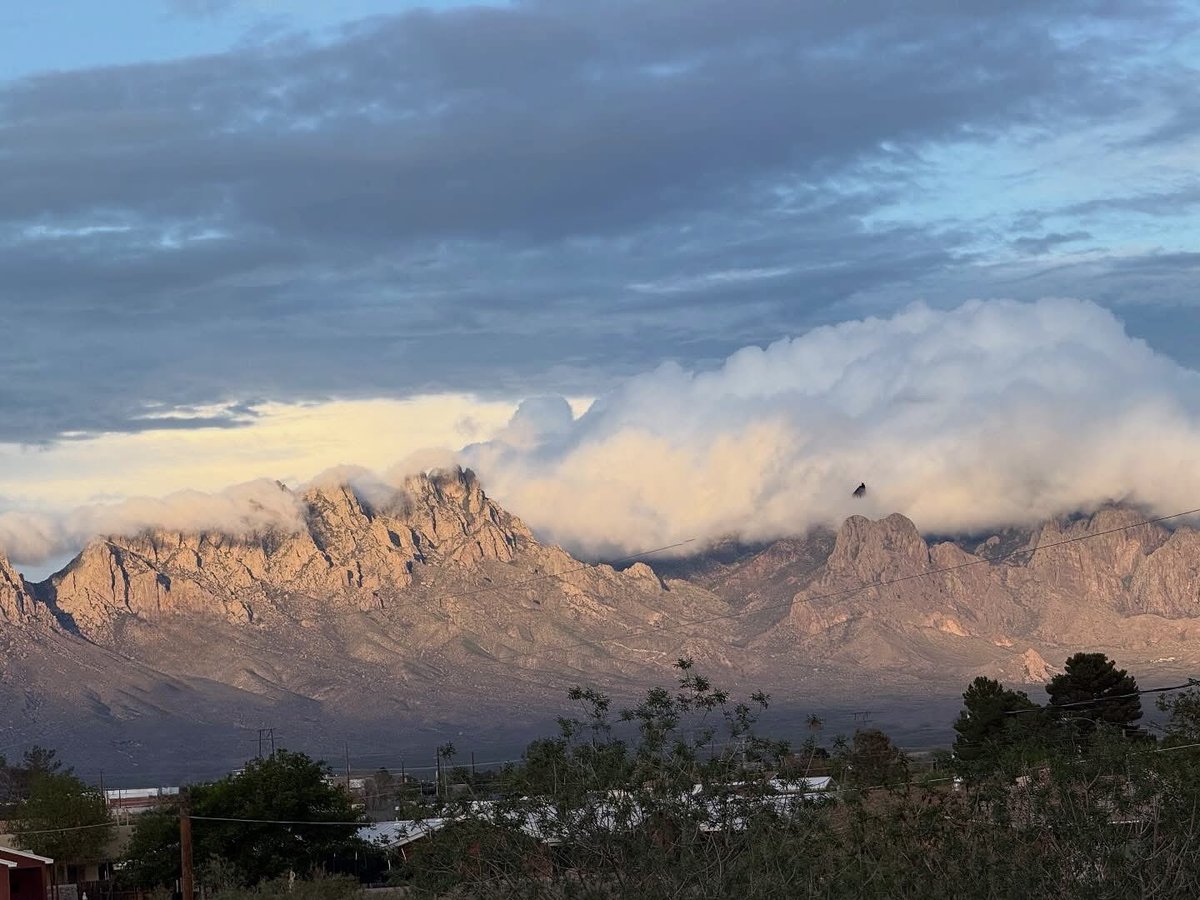 Chipper24's tweet image. A photo taken by a friend yesterday from their rooftop deck of the sun setting on the Organ Mountains.