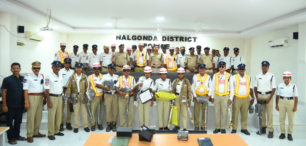 NalgondaCop's tweet photo. Monsoon Preparedness: District SP Supports Traffic Police and Home Guards

As the monsoon season begins, District SP Sharath Chandra Pawar IPS emphasized the importance of smooth traffic flow in towns and directed traffic police to perform duties effectively. To help them operate efficiently during rains, the SP distributed raincoats, jungle shoes, umbrellas, radium reflective jackets, goggles, and body-worn cameras to the traffic personnel.

He stressed that traffic police play a key role in visible policing and should regulate traffic responsibly, interact courteously with the public, and raise awareness about road safety and traffic rules to prevent accidents. He instructed them to stay present at their assigned traffic points, especially during rainy and nighttime duties, with the help of the provided traffic kits.

Additionally, the SP extended financial assistance from the Home Guard Welfare Fund — ₹15,000 each to families of three deceased home guards, ₹10,000 each to five undergoing medical treatment, ₹5,000 each to two for their children's marriages, and merit scholarships of ₹5,000 each to three children. He assured continued efforts for the welfare of home guards and urged them to bring any issues to his attention.
#Nalgonda_District_Police
#Sharat_Chandra_Pawar_IPS
