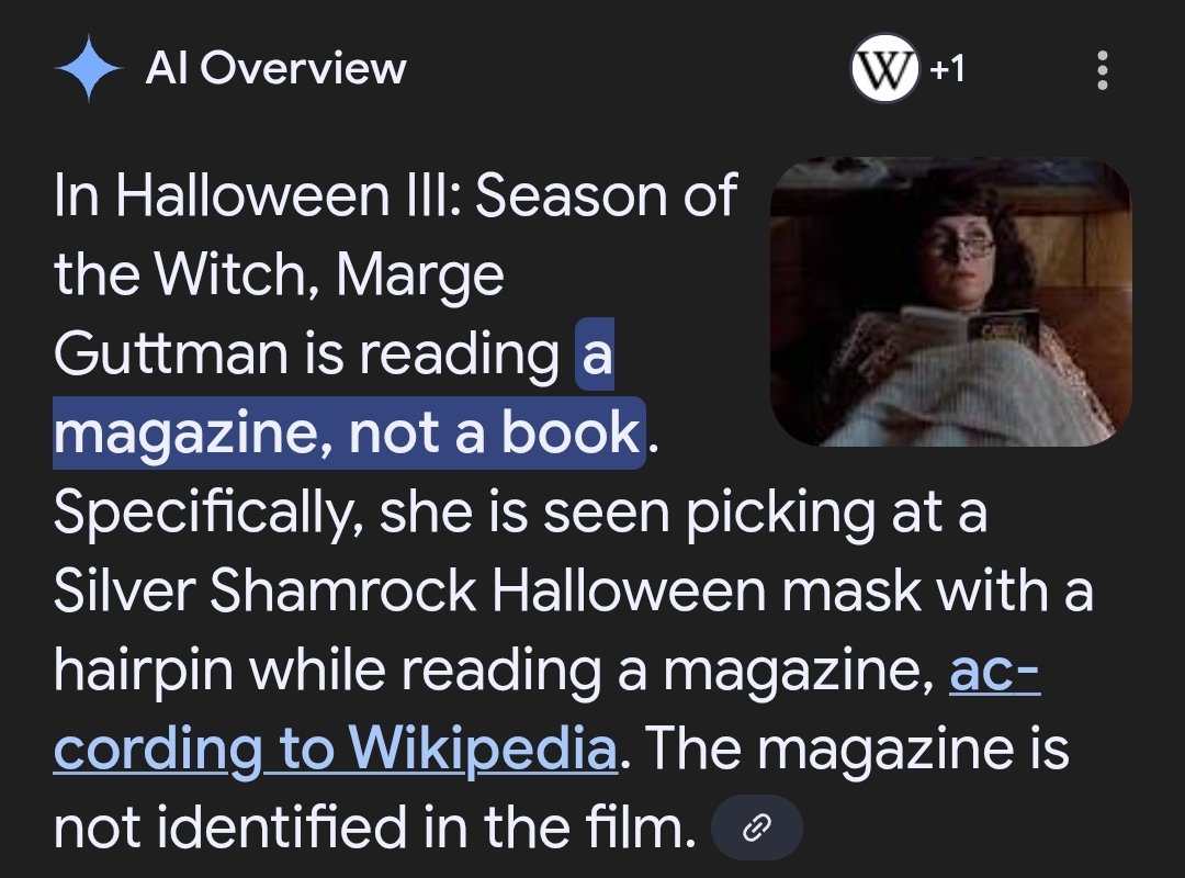 She is indeed reading a book, "The Eagle's Gift," by Carlos Castaneda, you stupid monkey!