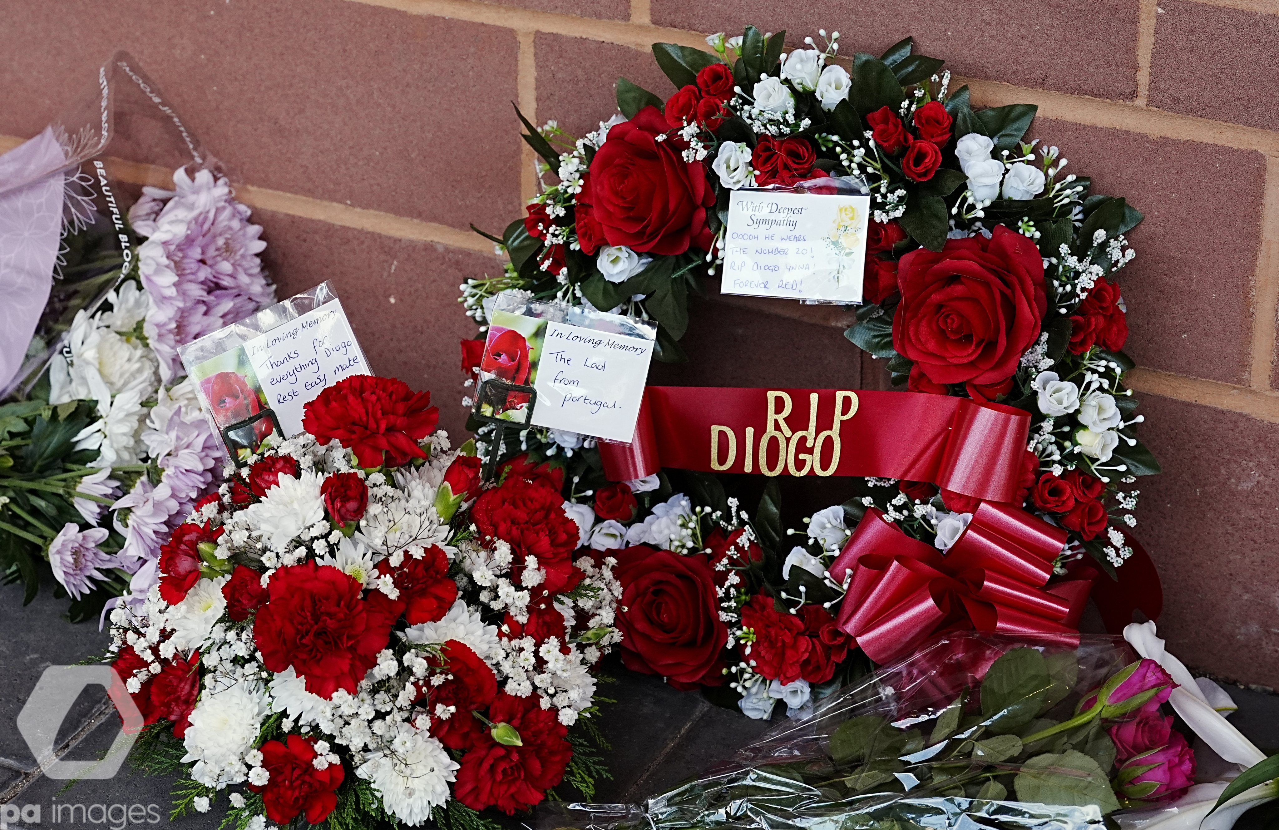 Floral tributes, including a wreath with a ribbon reading RIP Diogo, left at Anfield after the death of Diogo Jota