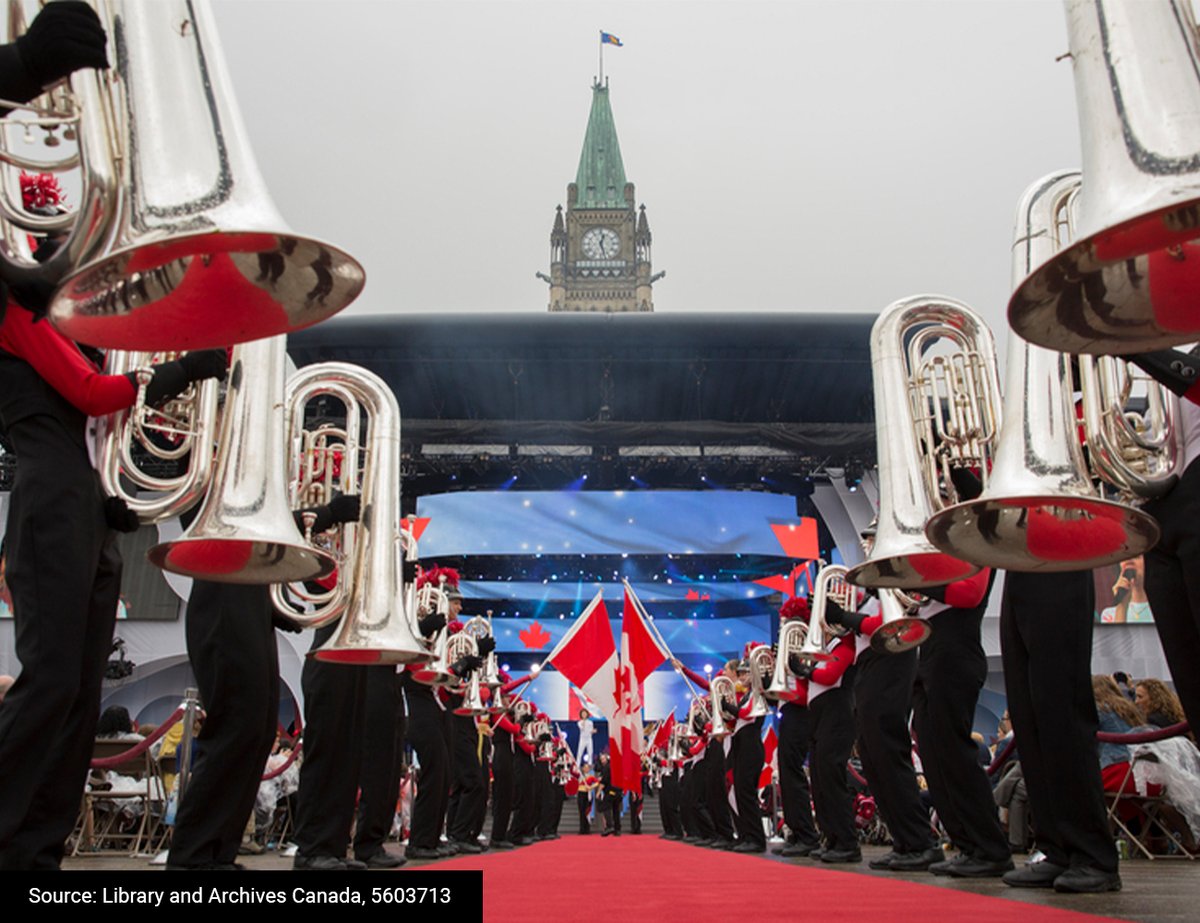 OurCommons's tweet image. #TBT to Canada Day on Parliament Hill. In this photo from 2015, the Peace Tower stands tall above a live band. Maple leaves abound! 🍁