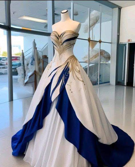 Elegant fusion of royal blue and ivory, adorned with intricate gold accents, creating a majestic gown fit for a modern princess.💃