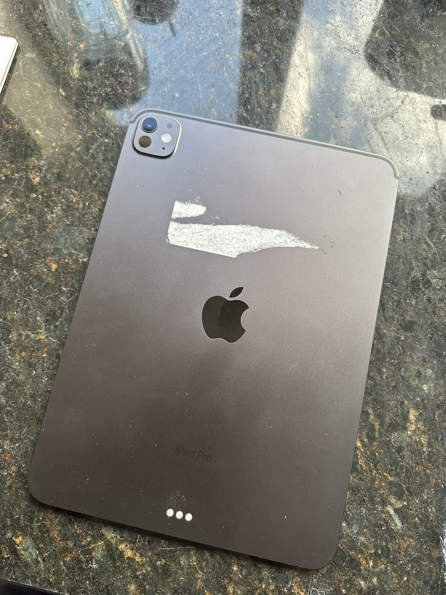 andyofengland's tweet photo. Got my iPad back from repair and whilst it’s great the screen is now all perfect again, it’s not great that there’s the remnants of a big sticker on the back. That’s not how I handed it over. @apple https://t.co/nFAnBs7MoT