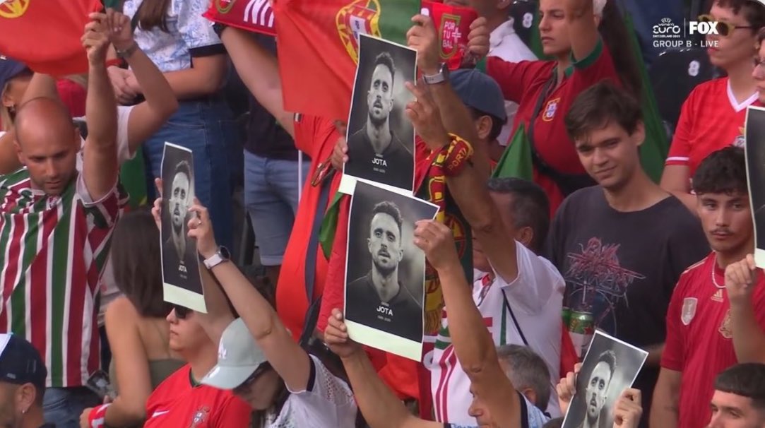 AnfieldRd96's tweet image. Portugal fans holding up Diogo Jota’s face at the Women’s Euros 🥺