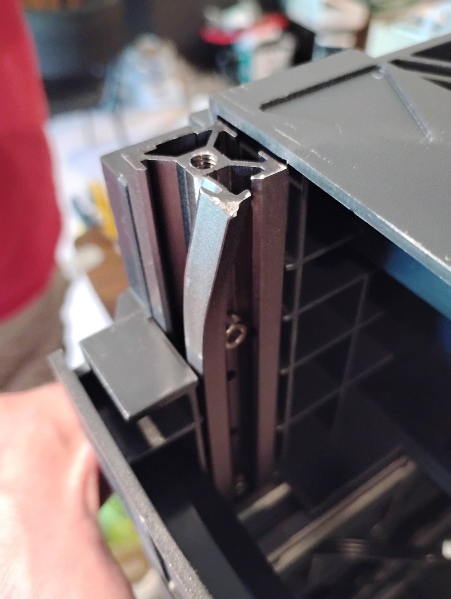 This is the worst case of damage in a product mailed to me that I've ever seen. And when you look at the photograph with the eyes of an engineer, it gets even more interesting. 

You're looking at a corner of the base unit on a Sovol SV08 3D printer. The bent thing is a 40mm x