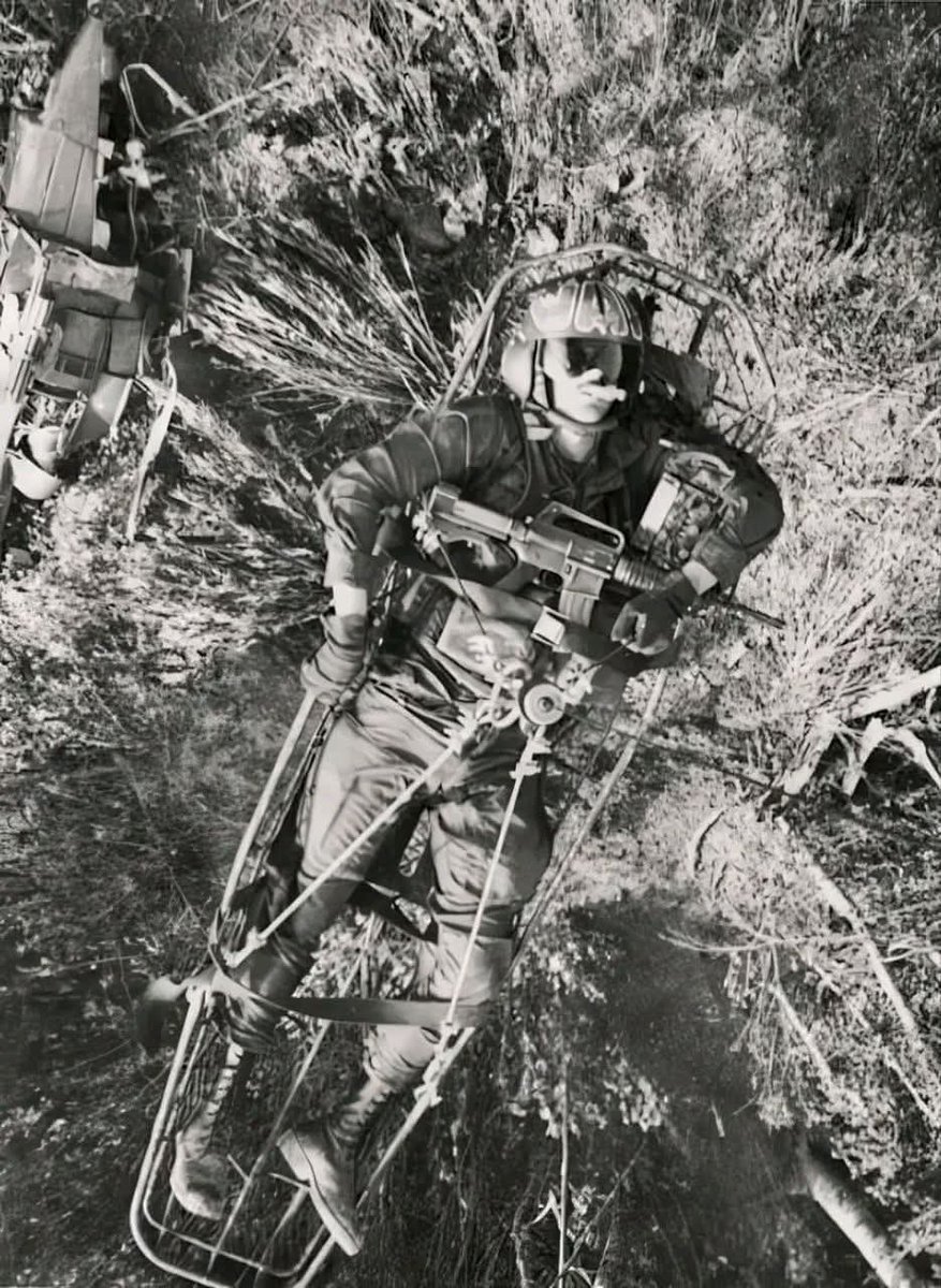 Quite the image... a downed Cobra pilot being hoisted aboard a rescue helicopter, Vietnam 1972.