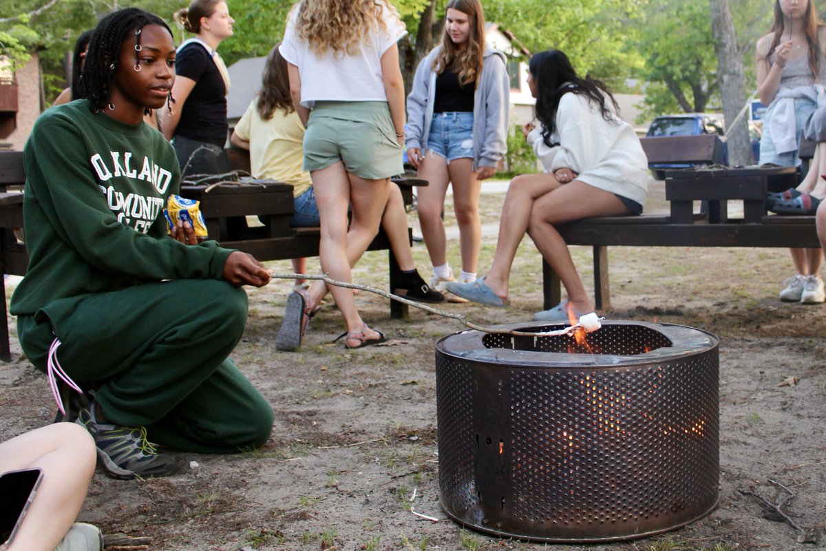 UMBS's tweet image. At the end of move-in day on July 1 for students taking courses in the summer term, the @UMBS community celebrated with s’mores along Douglas Lake.