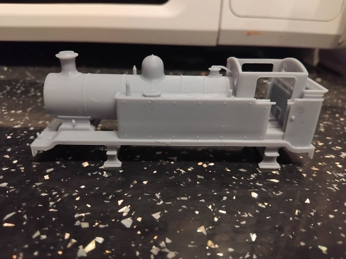 Two E2 Babby Tombo comparisons, only one is a 3.5mm H0 scale Breakfast Banger and the other a 4mm/00 scale E2 Baby.

Illustrates the subtle yet notible differences quite well.  In scale at least they are the same length.

Also showing a 3.5mm H0 Standard Tank E2 for kicks.  Might