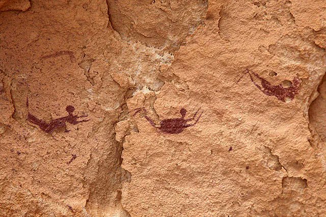 The Cave of the Swimmers features 8,000-year-old depictions of human figures seemingly floating or swimming in the middle of the Sahara Desert